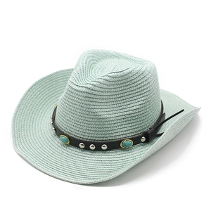 Detail of mint green straw cowboy hat with turquoise beads and silver rivets on leather band