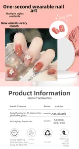 Macro detail of peach press-on nails with 3D embossed camellias and pearl accents