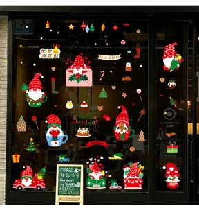 Christmas gnomes window static stickers showing festive glass decoration in a warm cafe shop