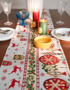 Detailed view of jacquard table runner with reindeer and snowflake motifs for Christmas