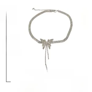 Detail showing 14.3g alloy necklace weight and 39.8cm length with butterfly rhinestones