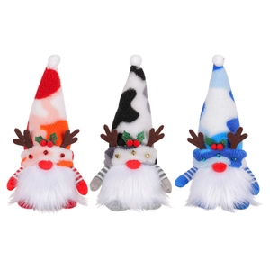 Three glowing Christmas gnomes with reindeer antlers and colorful hats on white background