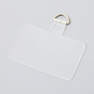 Close-up of transparent TPU phone lanyard patch with silver metal D-ring attachment
