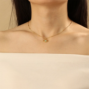 Gold evil eye pendant necklace for women with blue enamel pupil and unique cylinder chain