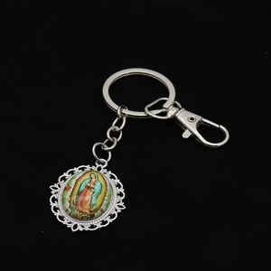 Detailed view of silver religious keychain with Our Lady of Guadalupe image pendant