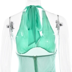 Detail view of light green halter dress back with mesh fabric and zipper closure