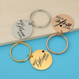 Polished stainless steel round keychains in silver, gold and rose gold with custom engraving