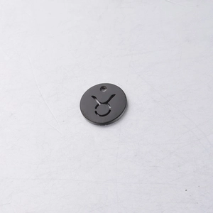 Detailed view of black titanium Taurus zodiac hollow pendant with mirror finish for DIY jewelry