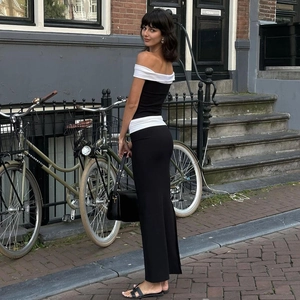 Street style street shot of black and white contrast tube top dress with handbag