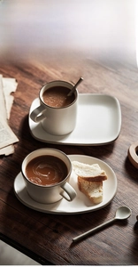Close-up of retro Banko-yaki ceramic coffee cup with glaze finish and matching tray