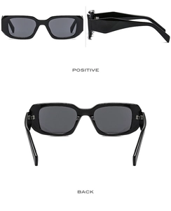 Macro detail of glossy black square sunglasses with thick geometric beveled frames