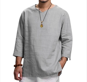 Close-up of gray men's loose fit V-neck long sleeve shirt showing cotton linen fabric texture
