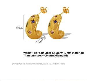Detail view of gold titanium C-shaped earrings with colorful inset zircon stones