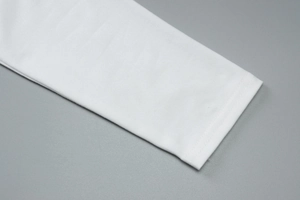 Close-up of white long sleeve cuff showing detailed double stitching and soft fabric
