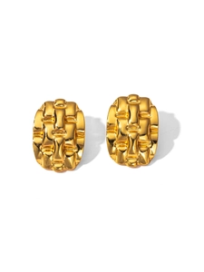 Detailed view of golden oval earrings with intricate woven texture and vintage metal relief
