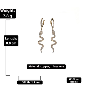 Detailed view of snake-shaped drop earrings with dimensions 8.8cm by 1.7cm in silver and rhinestones