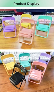 Detailed macro view of colorful macaron mini folding chair phone holders on a desk