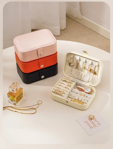 Internal view of portable PU leather jewelry box showing necklace hooks and ring slots