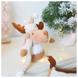 Close-up of plush Christmas reindeer ornament with sequined hat and knit scarf detail