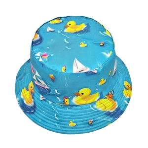 Blue reversible sun hat with yellow duck and summer prints for outdoor sun protection