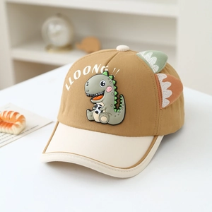 Detail of khaki toddler baseball cap featuring green dinosaur patch and 3D felt spine