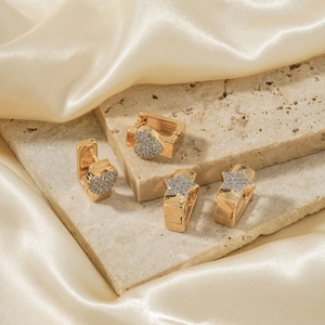 Elegant gold micro-set zircon heart and star hoop earrings set on champagne silk background