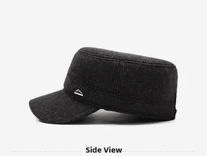 Detailed side view of winter men's flat top hat with tweed texture and mountain badge