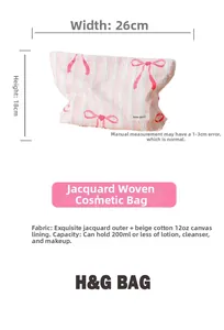 Detail of pink striped jacquard makeup bag with red bows and cotton canvas lining