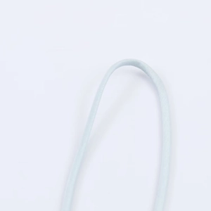 Macro detail of high-quality light blue braided lace trim with fine textile texture