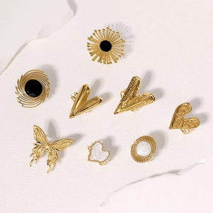 9-piece gold tone stainless steel ring set featuring butterfly, heart and sun motifs