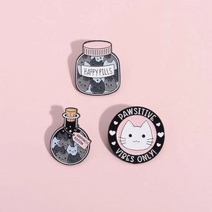 Cute cat enamel pins set featuring Happy Pills and Potion bottles on pink background