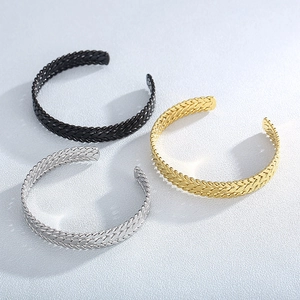 Detailed view of 9mm stainless steel wheat pattern open bracelets in black, gold, and silver