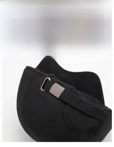 Close-up of the adjustable metal buckle and strap on a black winter earflap hat