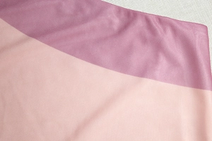 Close-up of semi-sheer gradient mesh fabric texture on fashion slim fit dress set