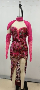 Detail of fuchsia floral embroidery and sequins on lace tube dress with high slit