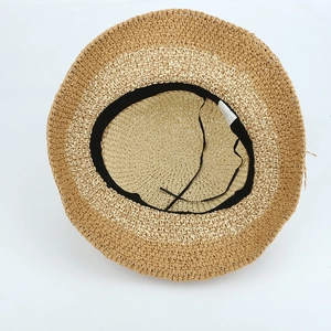Handmade crochet straw hat with wide brim showing internal sweatband and adjustable cord