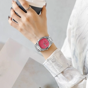 Women's quartz watch featuring a pink square dial and silver steel band on a model's wrist