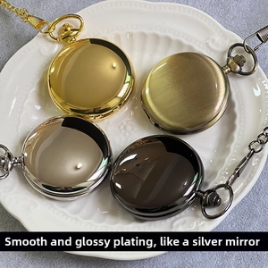 Detail of vintage pocket watches in gold, bronze, silver, and black on a lace plate