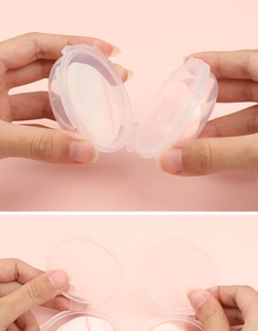 Mini thumb puff storage box with two clear cases on a soft pink background