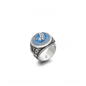 Close-up of a 24mm wide blue enamel eagle brotherhood signet ring in stainless steel