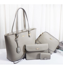Detail view of a 4-piece gray PU leather handbag set including tote and clutch bags