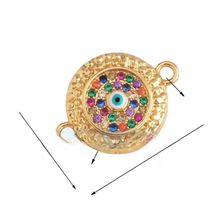 Macro detail of Turkish evil eye charm connector with multi-color zircon pavé for DIY jewelry