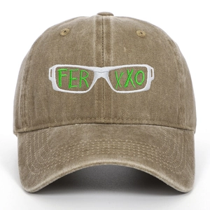 Close-up of FERXXO embroidery and green glasses logo on a brown washed baseball cap