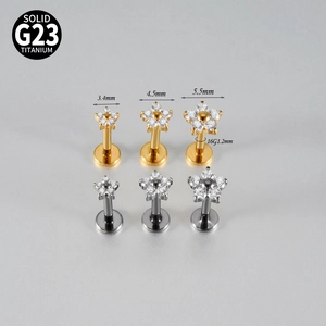 G23 titanium flower labret studs in gold and silver colors with white zircon insets