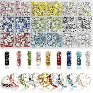 Macro detail of 24-color crystal rhinestone spacer beads in a clear organizer box