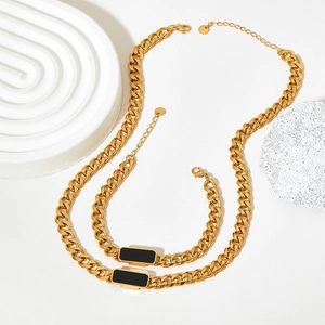 Gold chunky Cuban chain necklace and bracelet set with black rectangular enamel charms