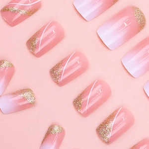 Pink and white gradient short press-on nails with gold glitter and white line details