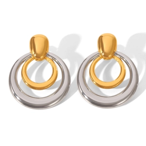 Detailed view of two-tone geometric hoop earrings with layered gold and silver rings