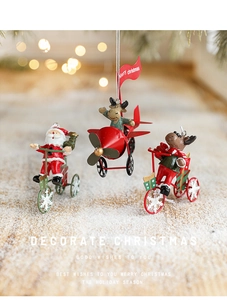 Detail of Santa Claus and Reindeer festive ornaments in a warm snowy holiday setting