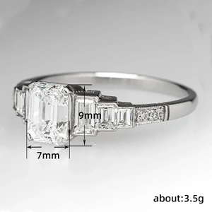 Classic emerald cut T-square cubic zirconia ring in white gold plating with side stones